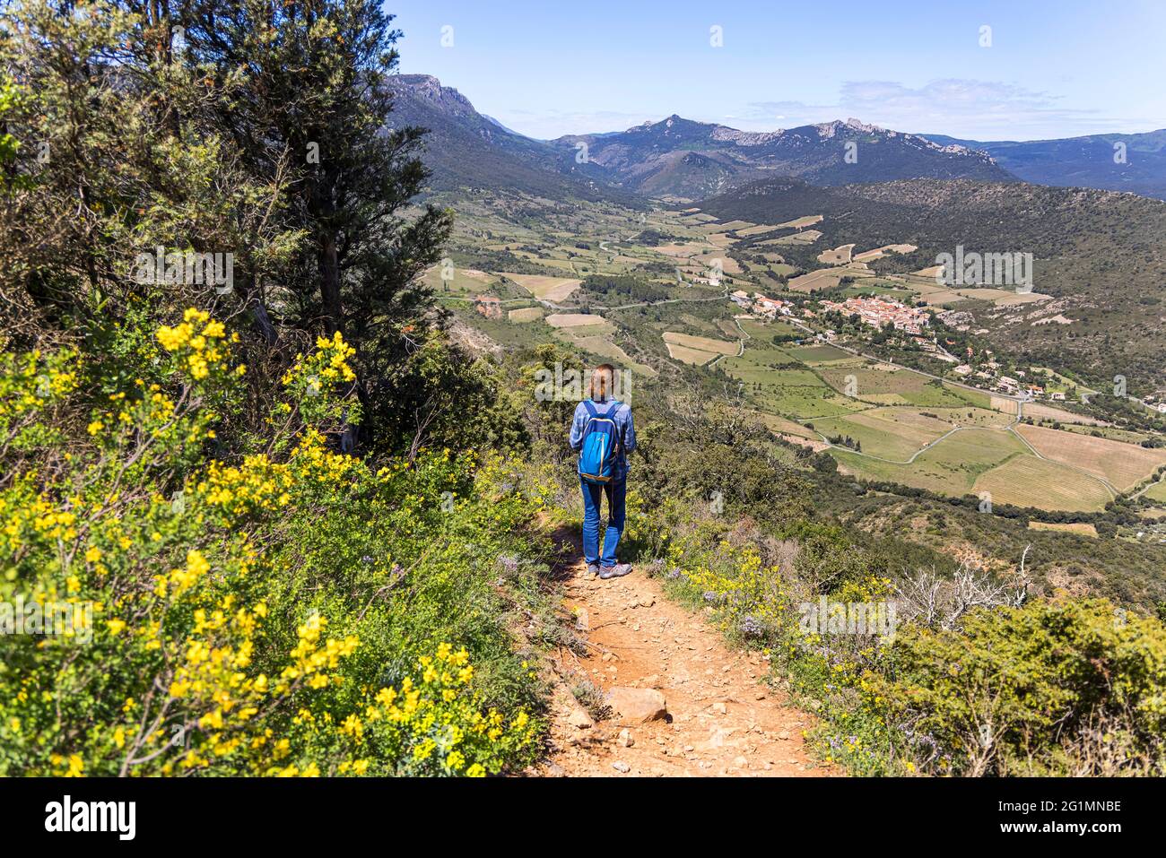France, Aude, Cucugnan, hiker on a trek leading to Cucugnan village Stock Photo