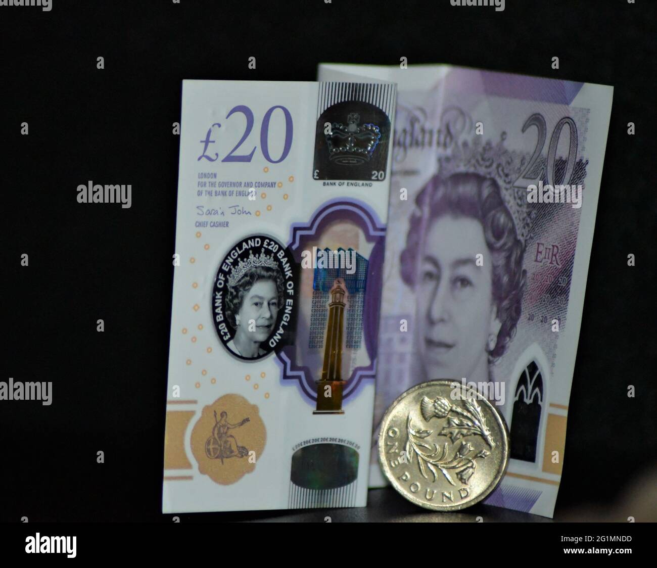2021 twenty pound note and one pound coin, Sterling Stock Photo