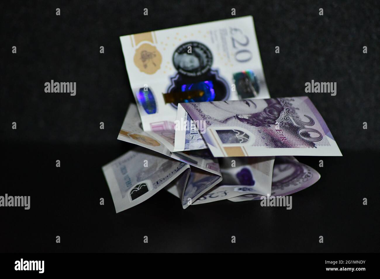 A pile of £20 pound notes, Sterling currency Stock Photo