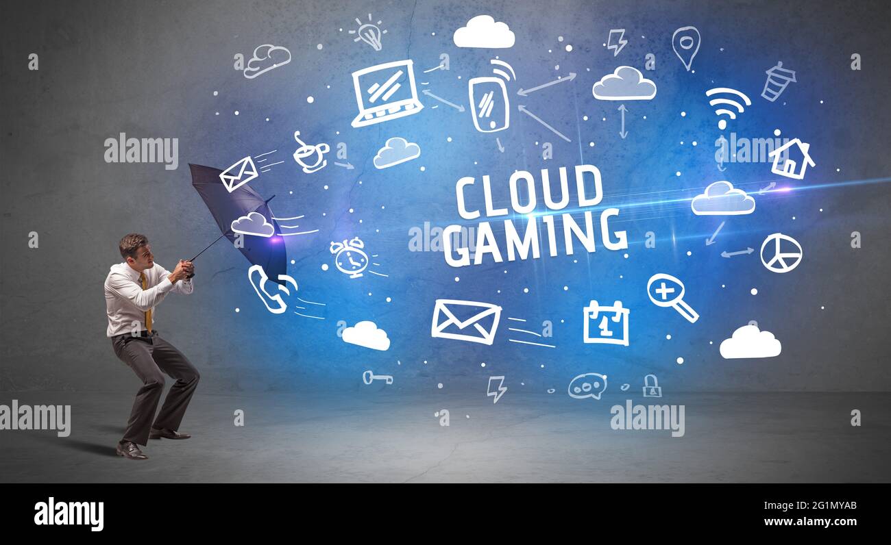 Businessman defending with umbrella, modern technology concept Stock Photo