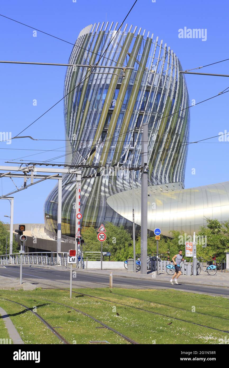 France, Gironde, Bordeaux, Bassins � flot district, Cit� du Vin designed by the architects XTU and opened in 2016 with the tram rails in the foreground Stock Photo