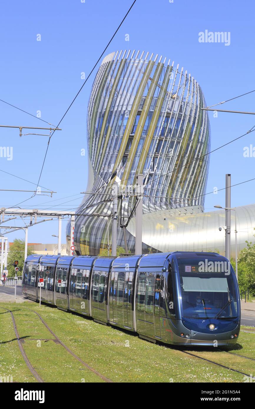 France, Gironde, Bordeaux, Bassins � flot district, Cit� du Vin designed by the architects XTU and opened in 2016 with the tramway in the foreground Stock Photo