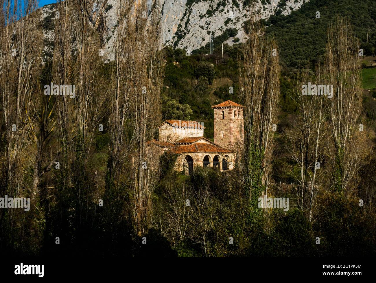 Spain, Cantabria, Picos de Europa, Potes, Church of St. Mary of Lebe�a, from the 10th century, in Mozarabic style, Spanish historical monument, in front of the cliffs of the Hermida canyon Stock Photo