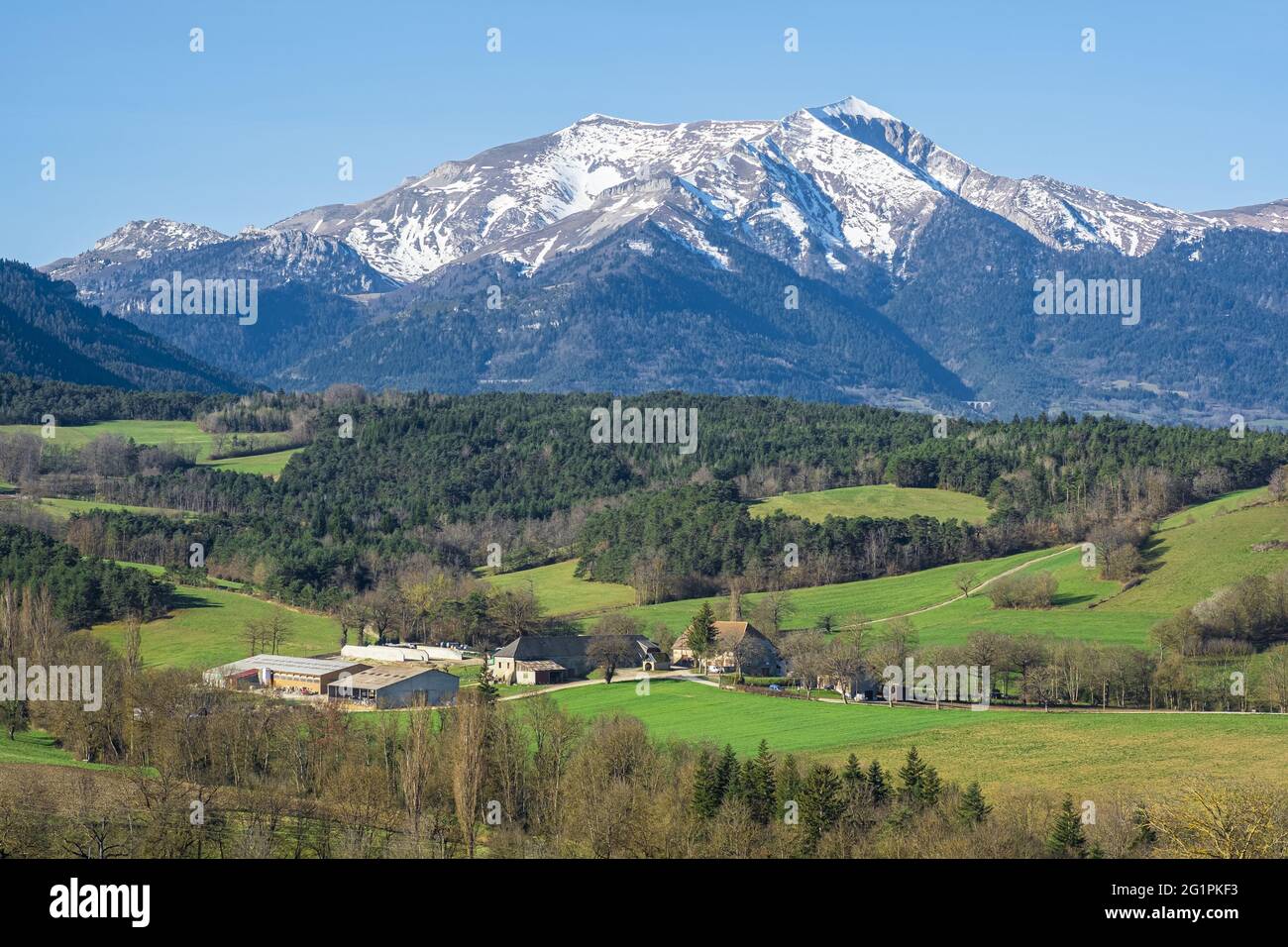 France, Isere, Trieves region, surroundings of Mens, agricultural property and Le Jocou (2051m) in the background Stock Photo