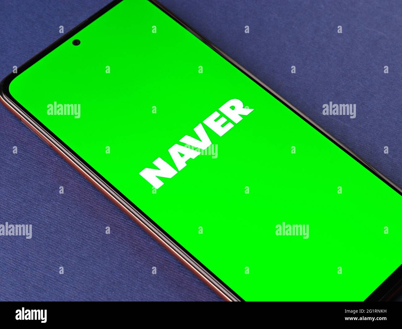 Assam, india - May 29, 2021 : Naver logo on phone screen stock image. Stock Photo