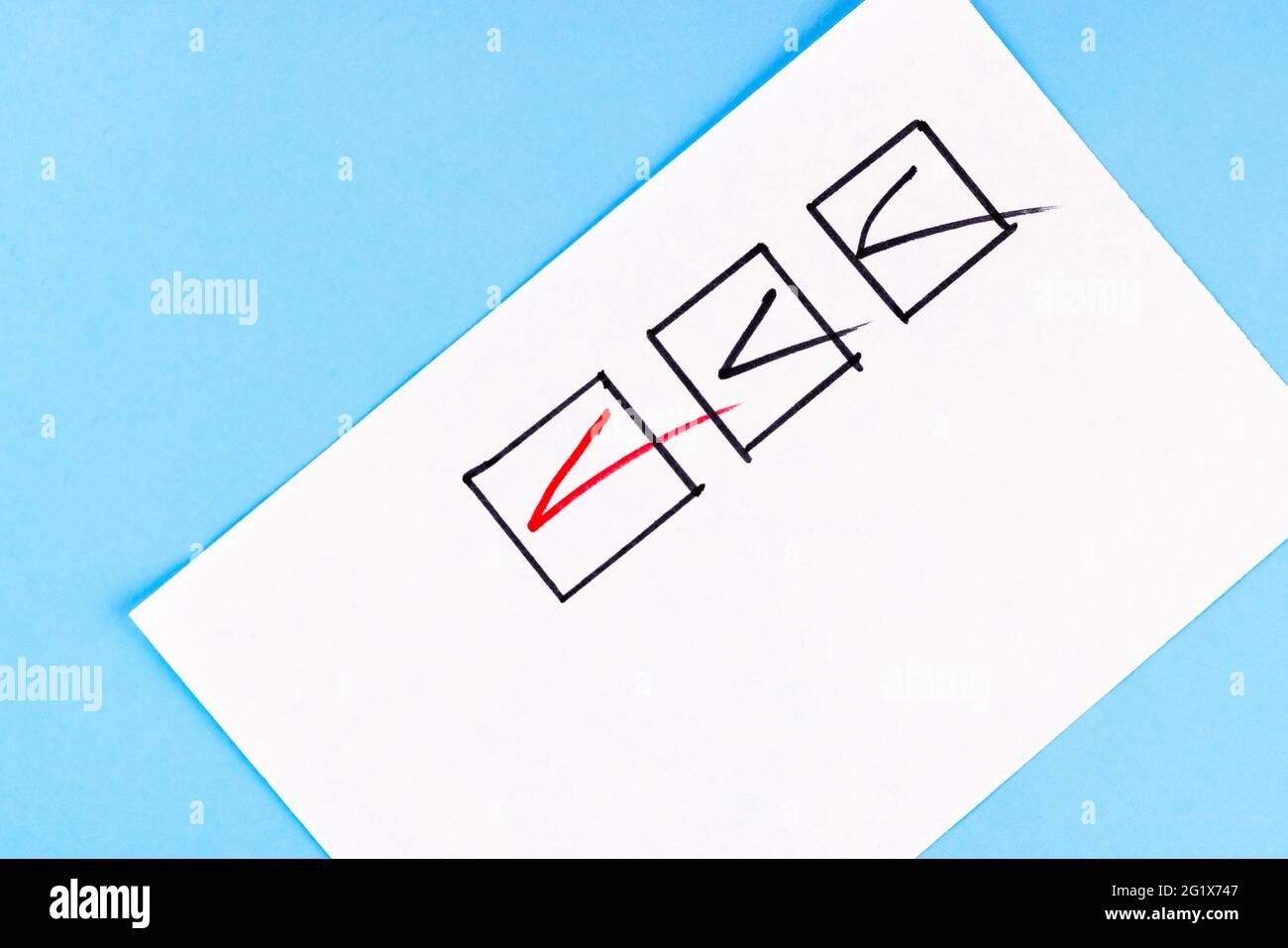 Red marking on checklist box with pen, Checklist concept. Stock Photo