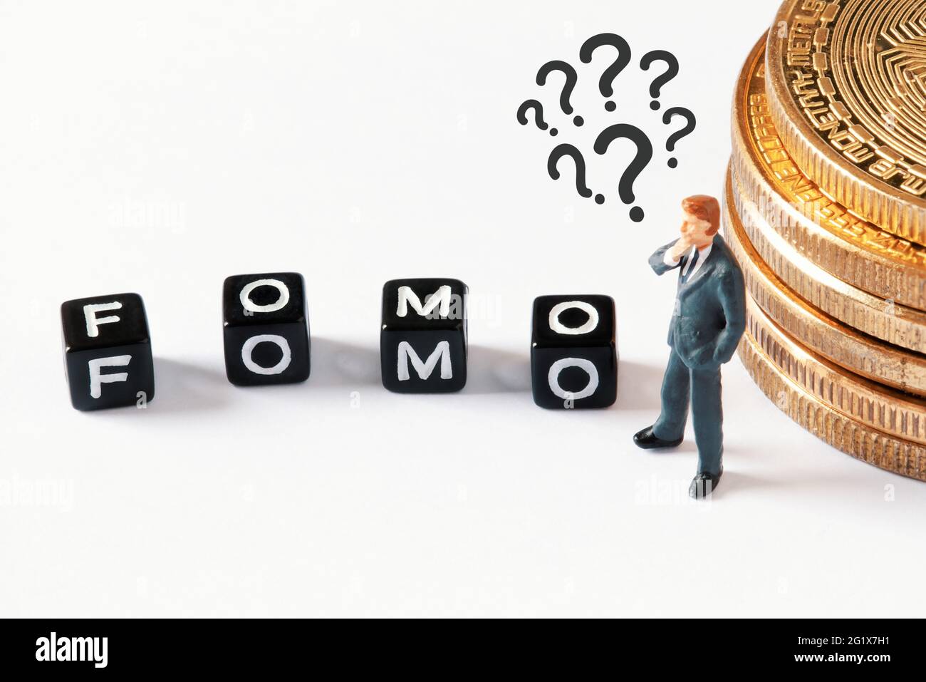 Scattered black cubes with FOMO text on white background. Thinking  businessman figurine looking at cubes next to bitcoin stack. Cryptocurrency,  blockc Stock Photo - Alamy