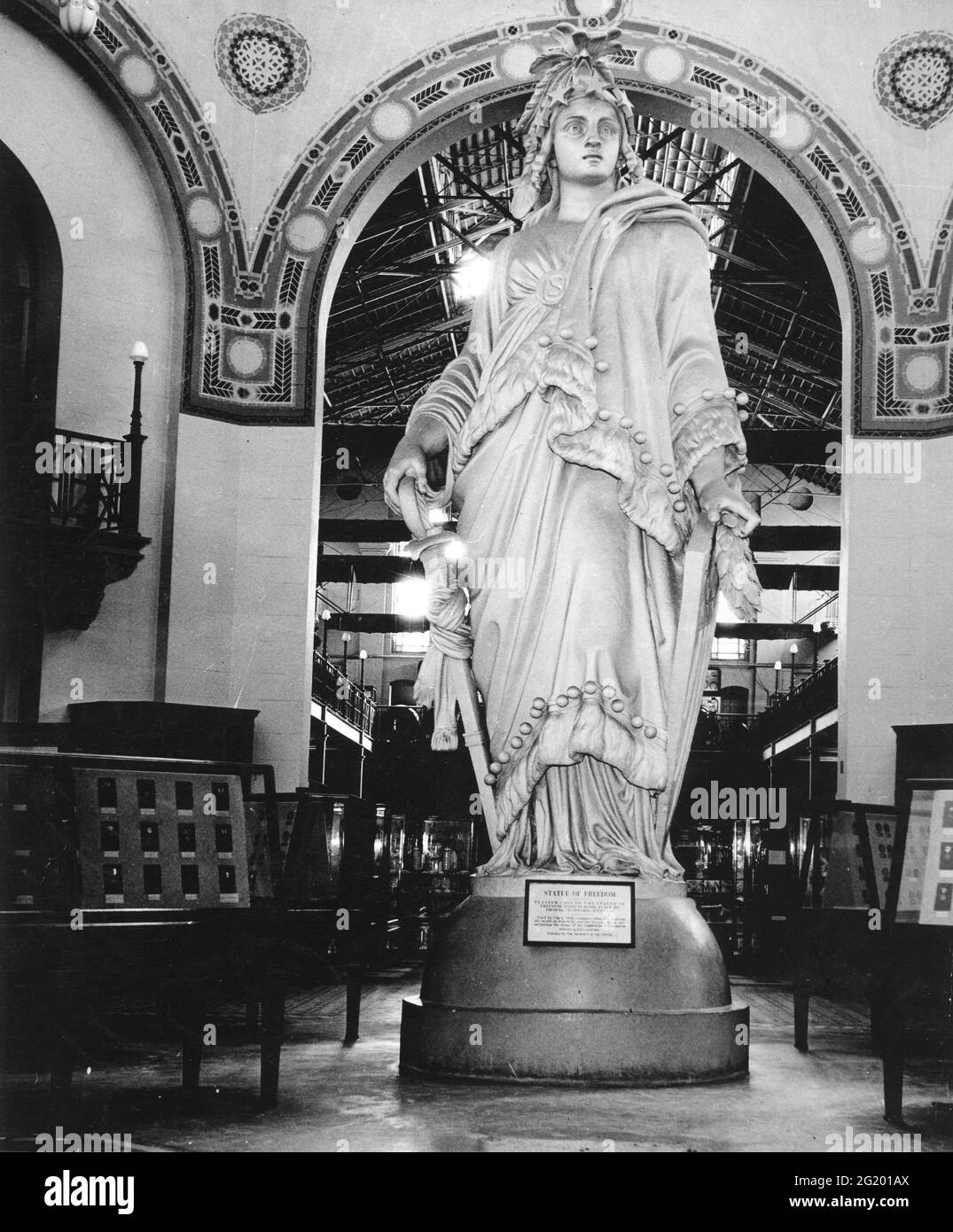Plaster cast of the bronze Statue of Freedom made by sculptor Thomas Crawford in 1860 to top the dome of the United States Capitol. The cast is shown here in the Arts & Industries Building of the Smithsonian Institution where it was exhibited from 1900-1967, Washington, DC. (Photo by Harris & Ewing/RBM Vintage Images) Stock Photo