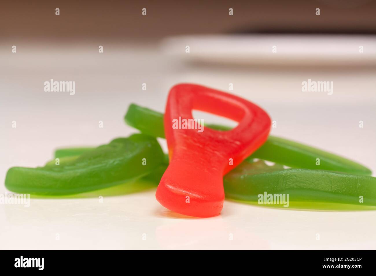 Red and green gummy candies in various shapes Stock Photo