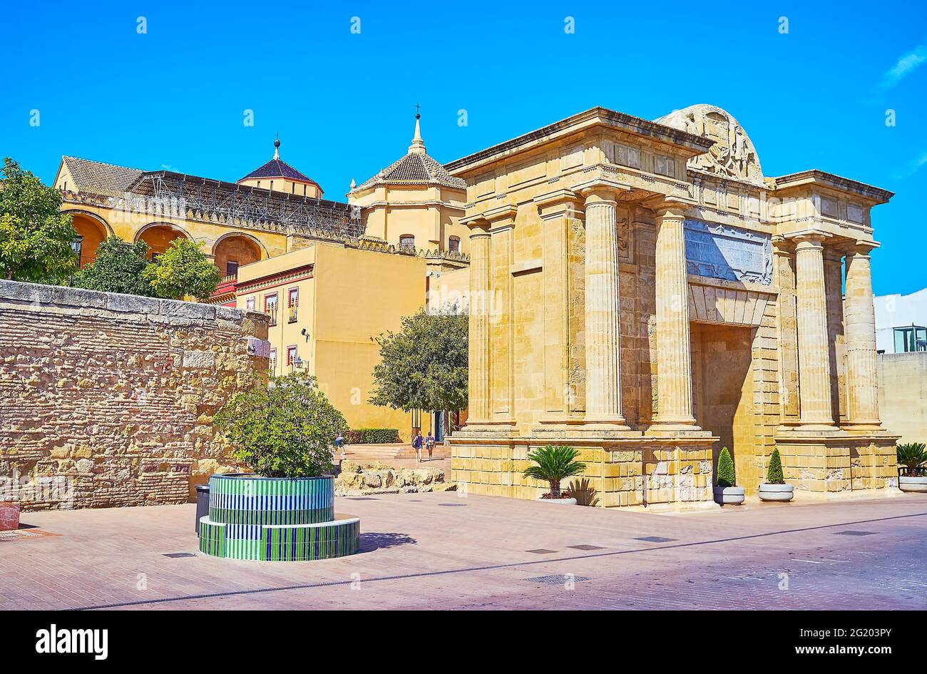 The picturesque facade of Puerta del Puente or the Bridge Gate of Cordoba, decorated with carved patterns, columns and wall sculptures, Spain Stock Photo