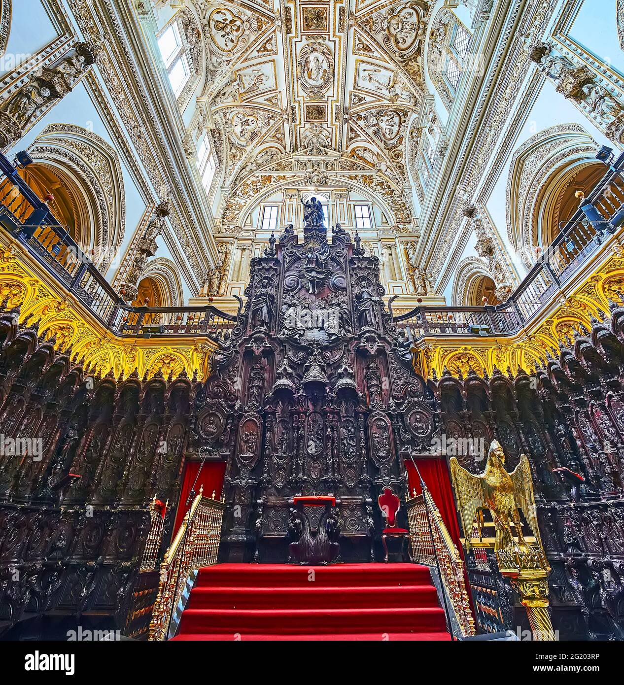 CORDOBA, SPAIN - SEP 30, 2019: The richly decorated carved wooden choir stalls in Capilla Mayor (Main Chapel) of Mezquita- Catedral, on Sep 30 in Cord Stock Photo