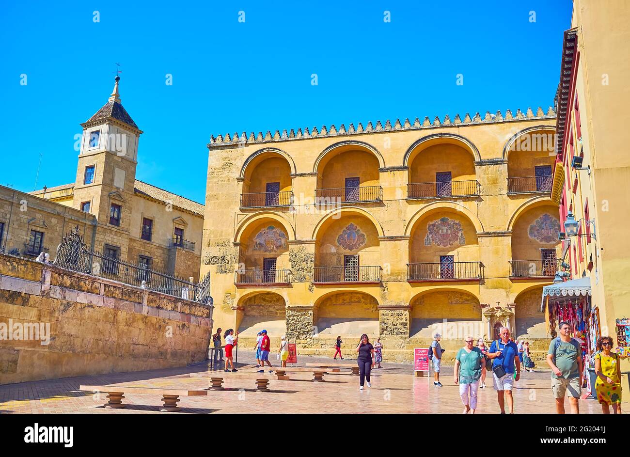 CORDOBA, SPAIN - SEPTEMBER 30, 2019: Walk Triumph Square and enjoy the view of medieval wall of Mezquita, decorated with niches and coats of arms, on Stock Photo