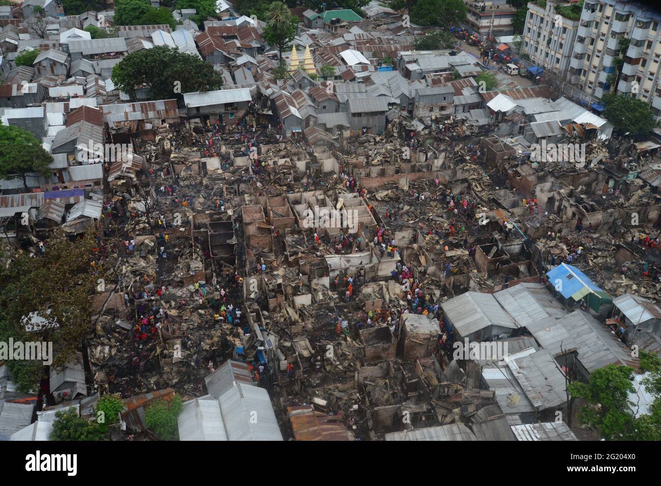 A top view of Mohakhali slum after a devastating fire that broke out in Dhaka, Bangladesh, on June 7, 2021. At least 300 shanties were gutted as the devastating fire that broke out at Mohakhali slum in Dhaka. Stock Photo