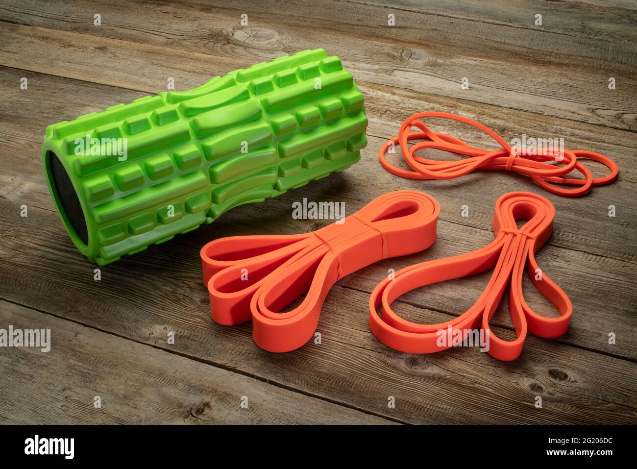 foam roller and resistance bands, exercise, therapy, recovery and rehabilitation concept Stock Photo