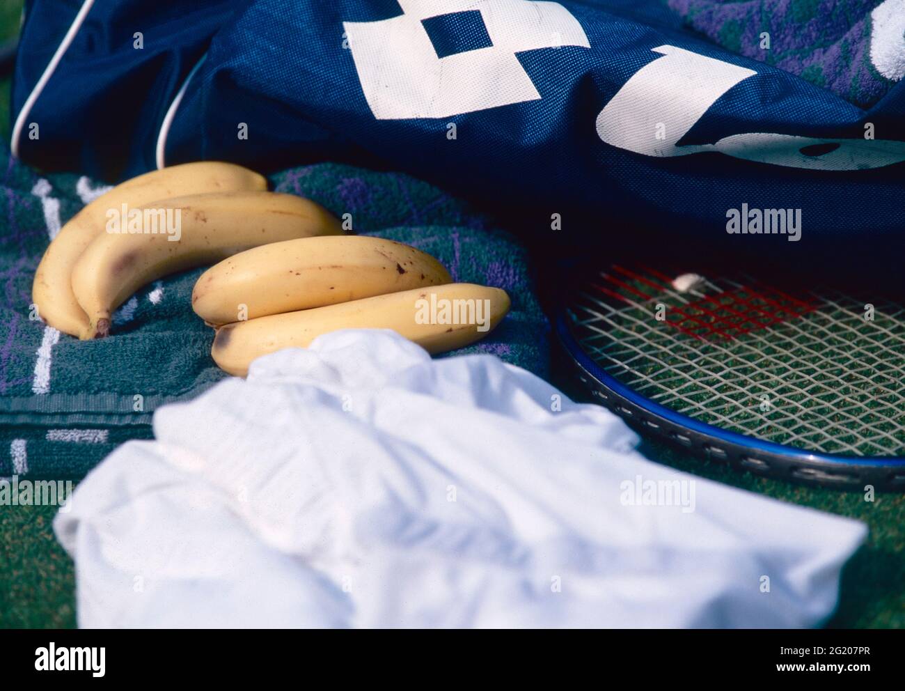 Bananas and tennis racket Stock Photo