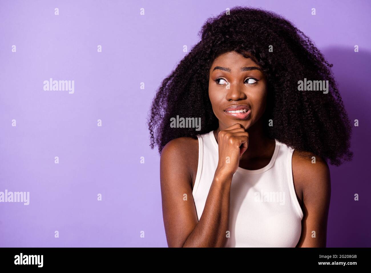Portrait of attractive worried girl creating solution copy space overthinking isolated over bright violet purple color background Stock Photo