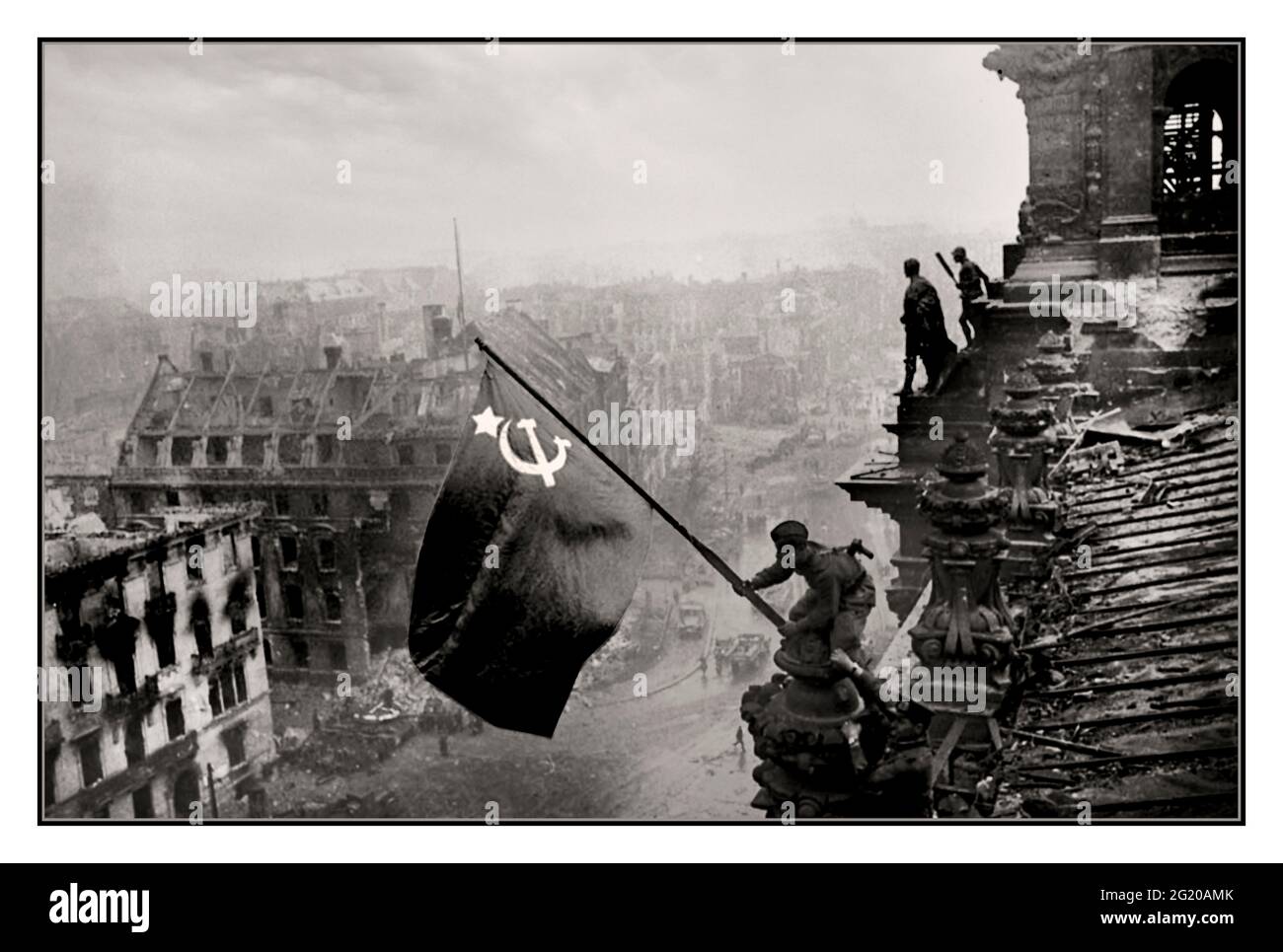 RUSSIAN ARMY BERLIN SOVIET FLAG OVER NAZI REICHSTAG World War II Germany Iconic image of raising a Russian Soviet flag over the Reichstag, an historic World War II photograph, taken during the Battle of Berlin on 2 May 1945. It shows Meliton Kantaria and Mikhail Yegorov raising the Hammer and Sickle flag over the Berlin Reichstag Berlin Germany WW2 Red Army Soviet Soldiers Hammer and Sickle Soviet flag Nazi Headquarters Reichstag, Berlin Germany 1945 Stock Photo