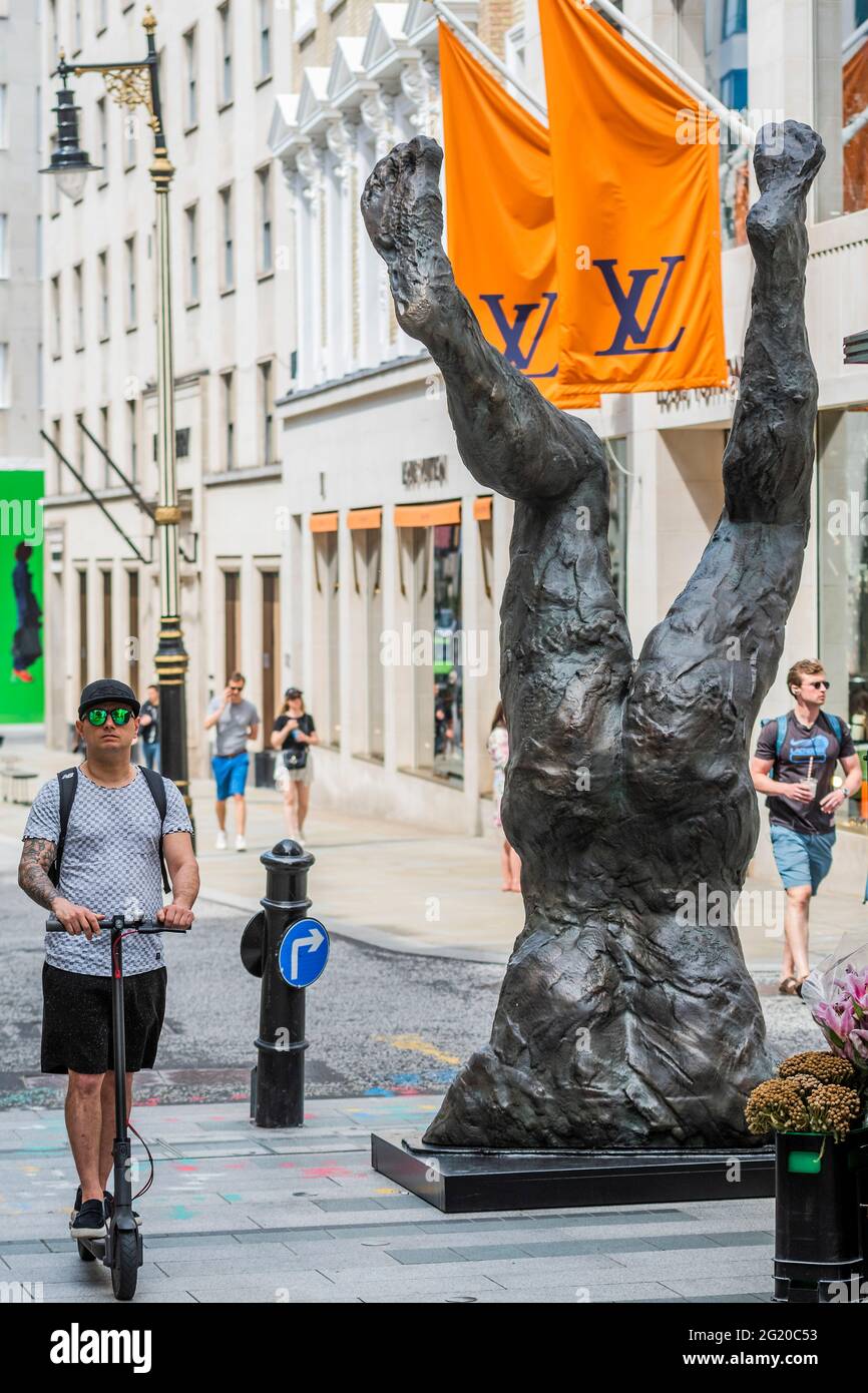 London, UK. 7th June, 2021. Shoppers near Louis Vuitton are out in the sun  around David Breuer-Weil's Alien 2 at the bottom of New Bond Street -  Public art sculptures by contemporary