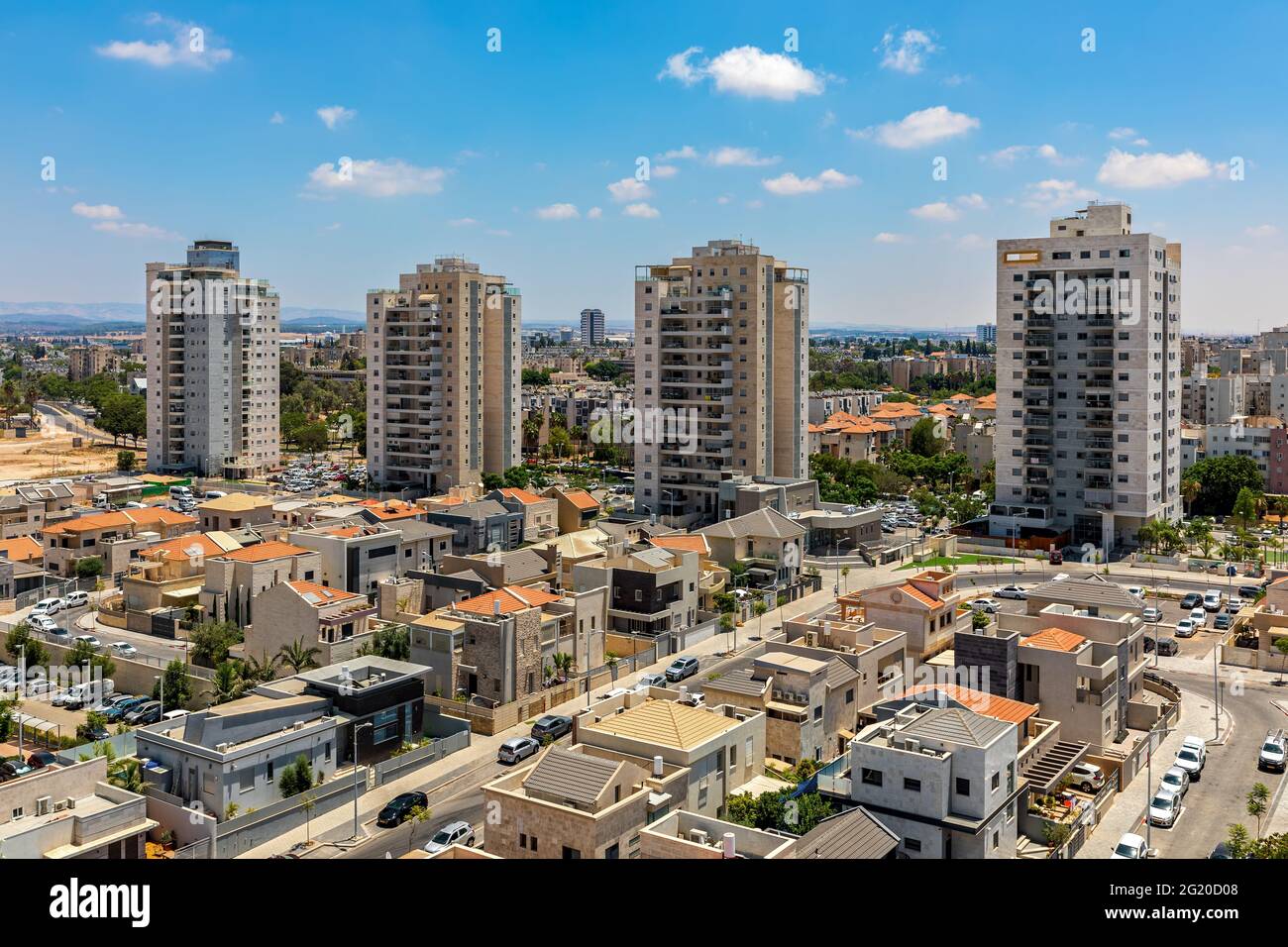 New villas, private houses and residential buildings under blue sky in a new neighborhood of city of Kiryat Gat, Israel. Stock Photo