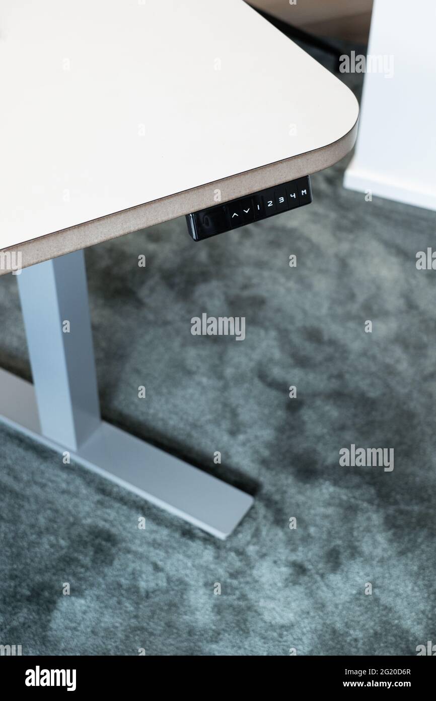 Smart heightadjustable desk or standing desk. Modern office equipment