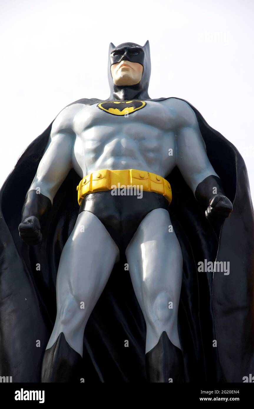 Figure of DC Comics superhero character Batman aka The Caped Crusader.  created by Bob Kane and Bill Finger. Displayed in a suburban front garden.  UK Stock Photo - Alamy