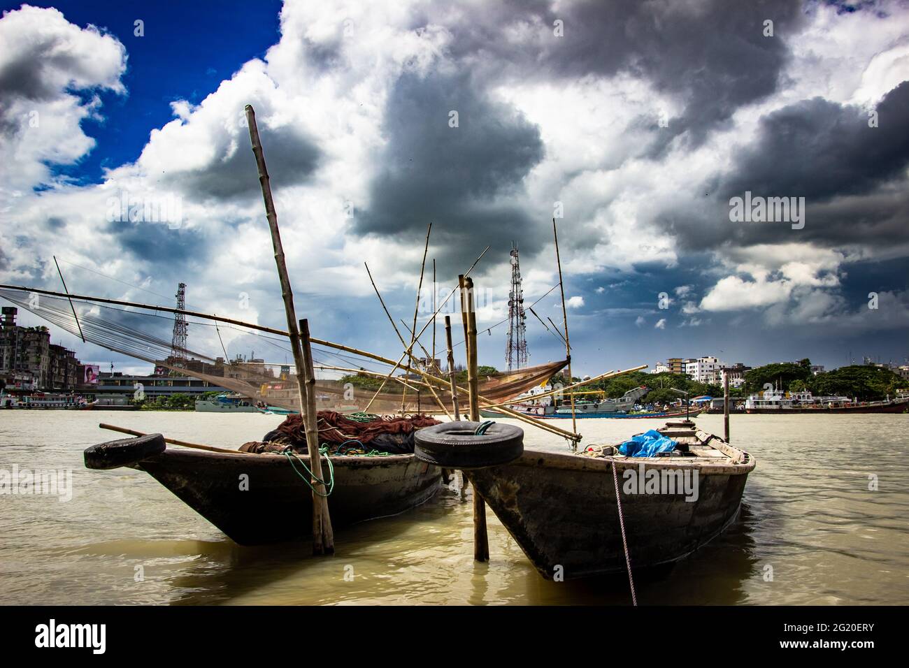 Traditional fishing boat on the riverbank under the cloudy sky, This image captured on September 21, 2018, from Narayangonj, Bangladesh, South Asia Stock Photo