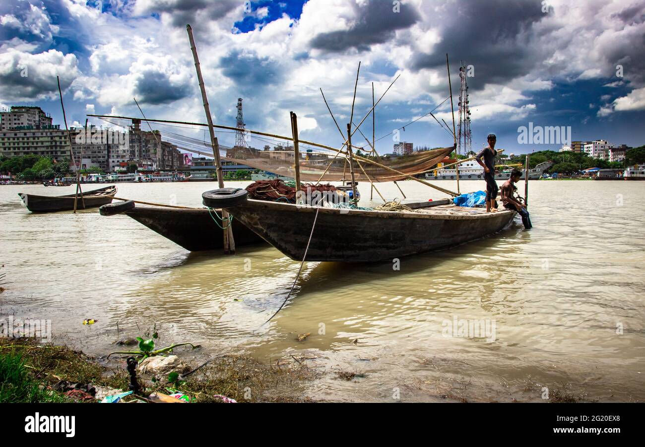 Traditional fishing boat on the riverbank under the cloudy sky, This image captured on September 21, 2018, from Narayangonj, Bangladesh, South Asia Stock Photo