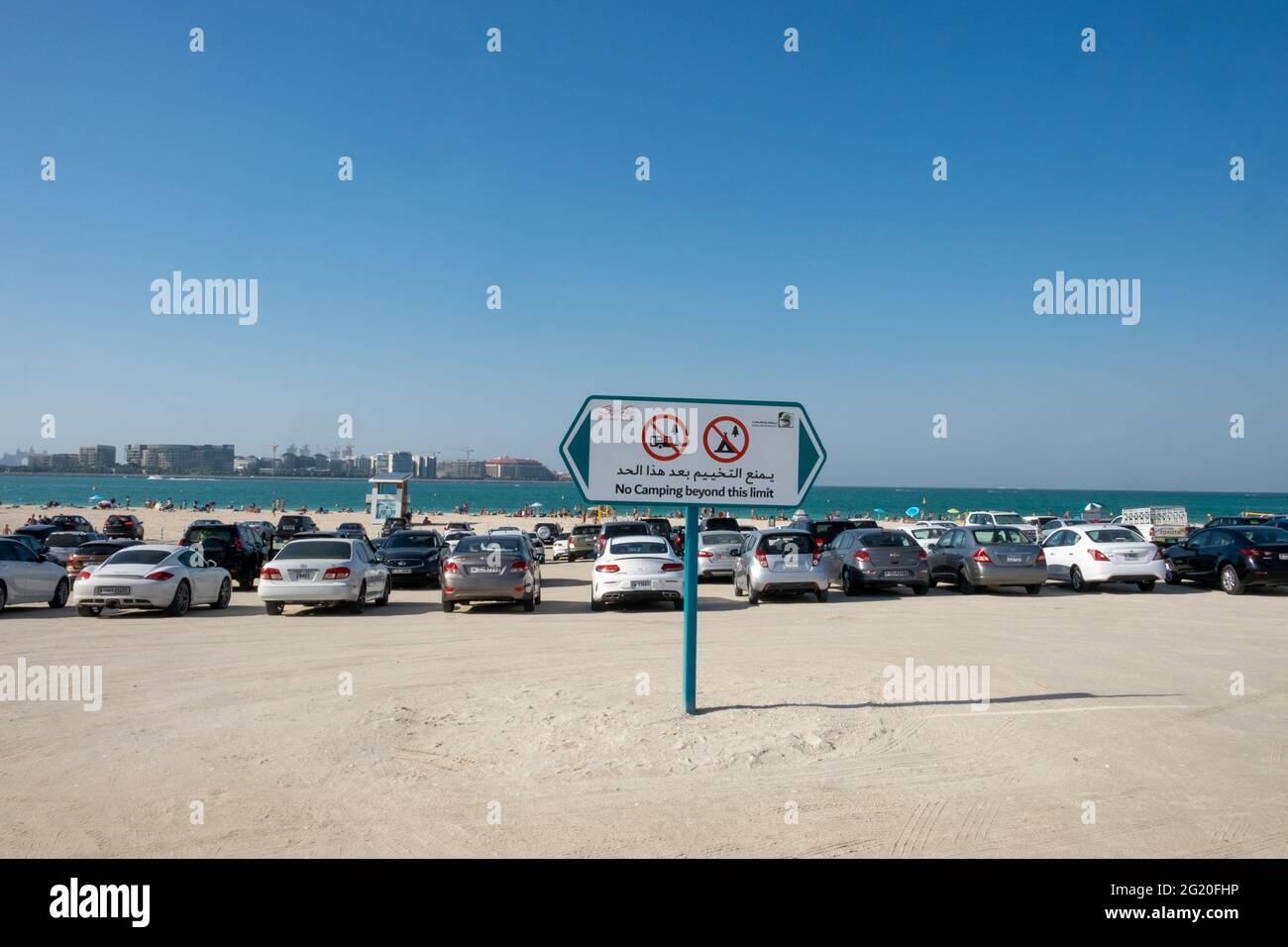A car park with a view cars parked on one of the few public beaches