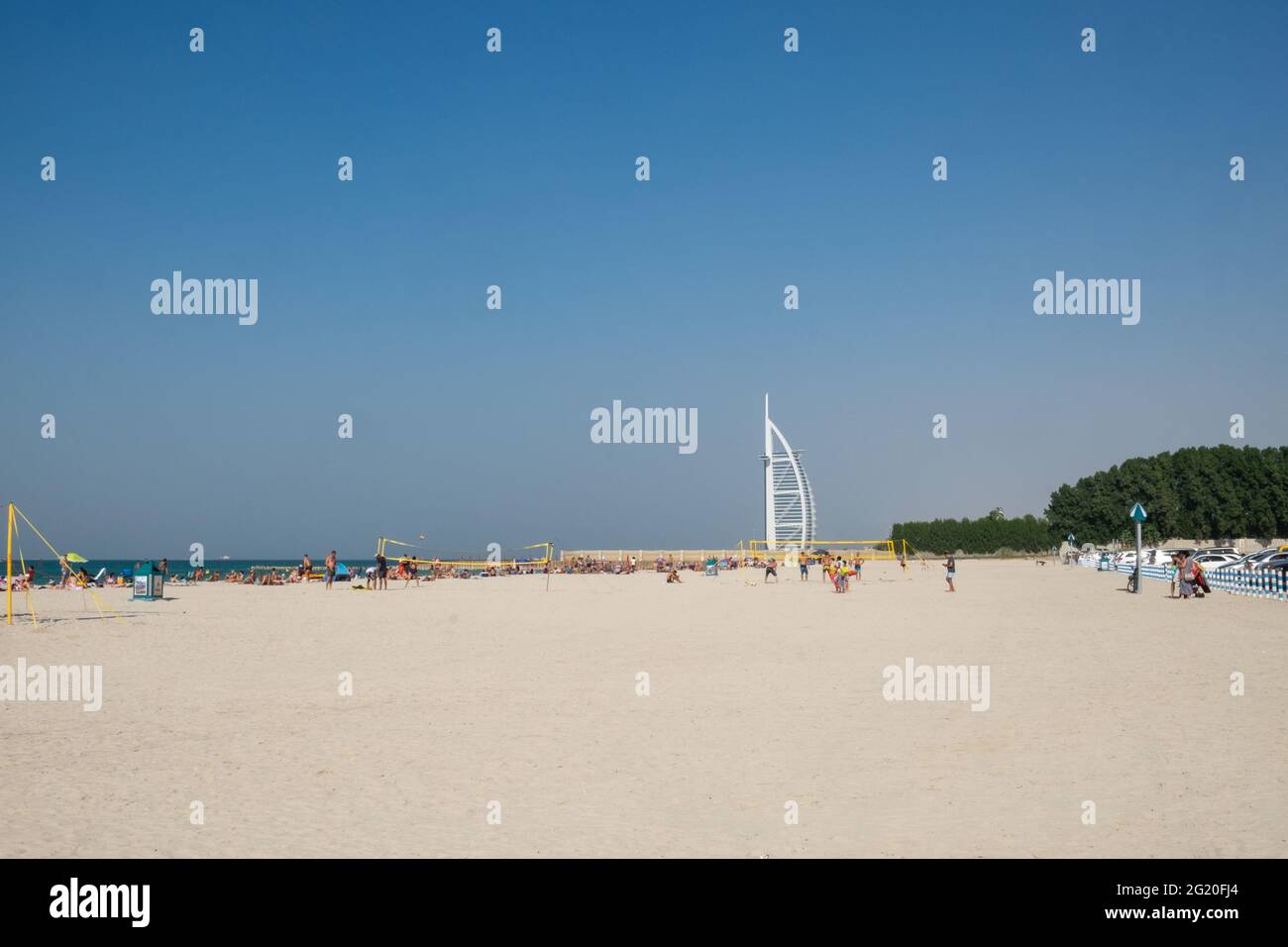 Sofouh Beach with the white sail of Burj Al Arab visible in the distance. Dubai, UAE. Stock Photo