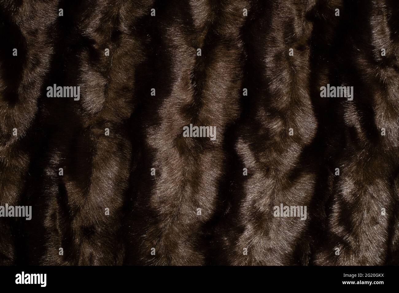 Dark artificial fur textile material. Stock Photo