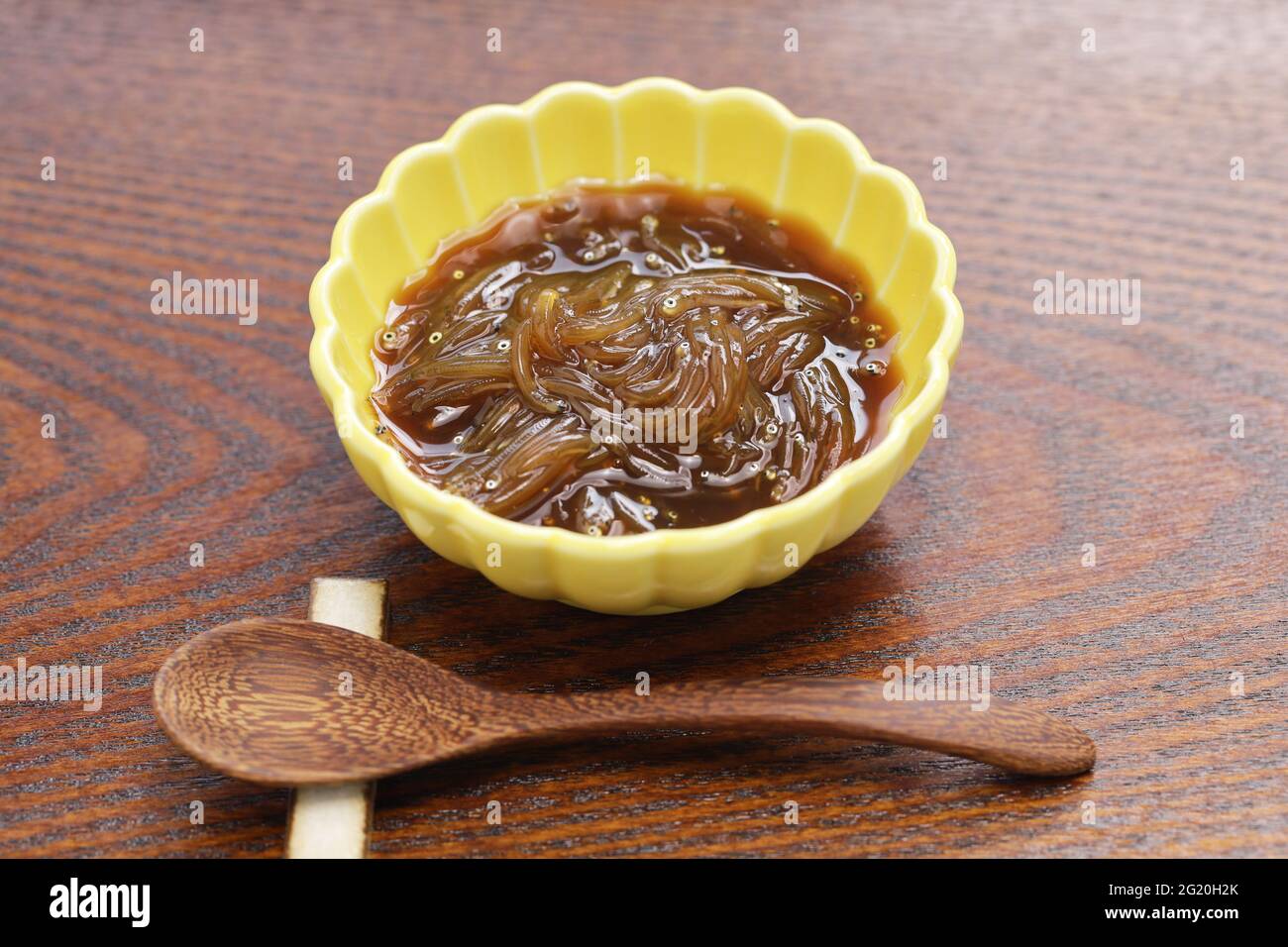 Freshly small fish pickled in soy sauce in a fishing boat. Japanese delicacy food called Sirasu no okizuke. Stock Photo