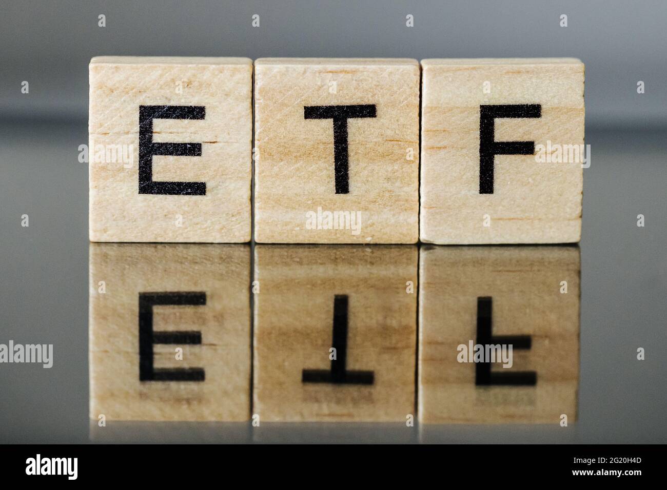 ETF Exchange-traded fund on wooden letters Stock Photo