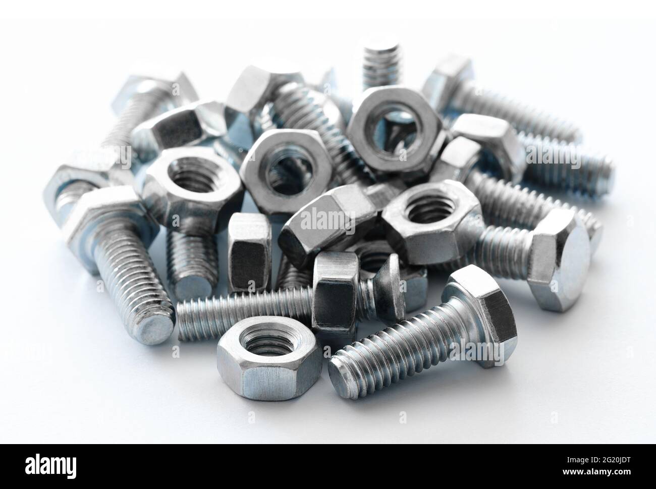 Metal nuts and bolts Isolated on white background Stock Photo - Alamy