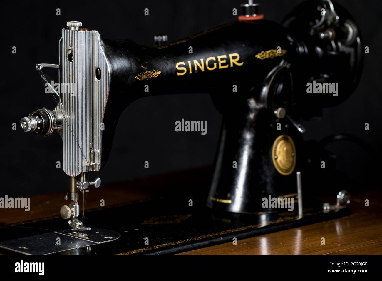 Vintage sewing machine close up singer 15-91. Black and gold detailed retro Singer sewing machine. Stock Photo
