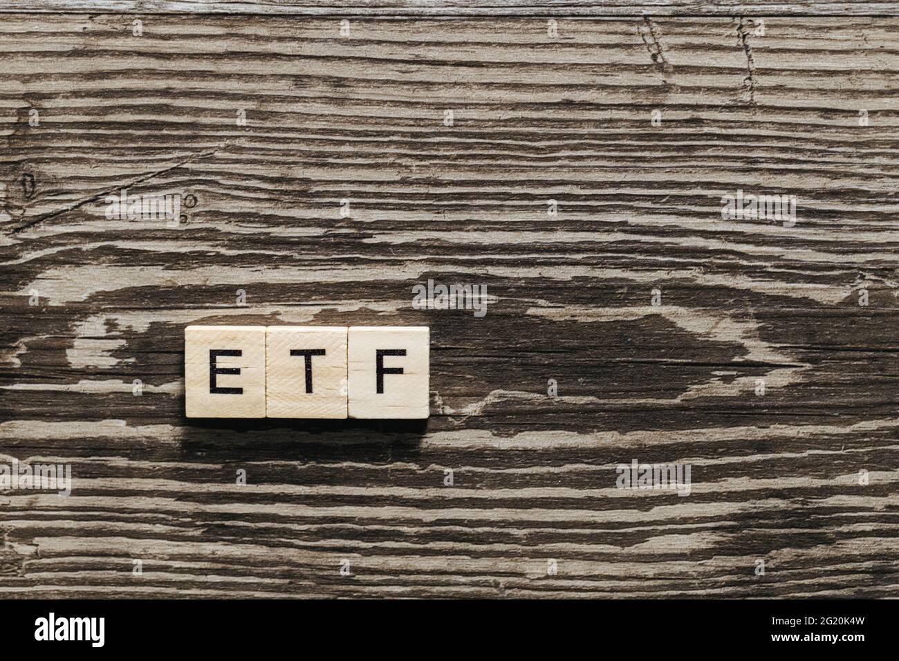ETF Exchange-traded fund on wooden letters Stock Photo