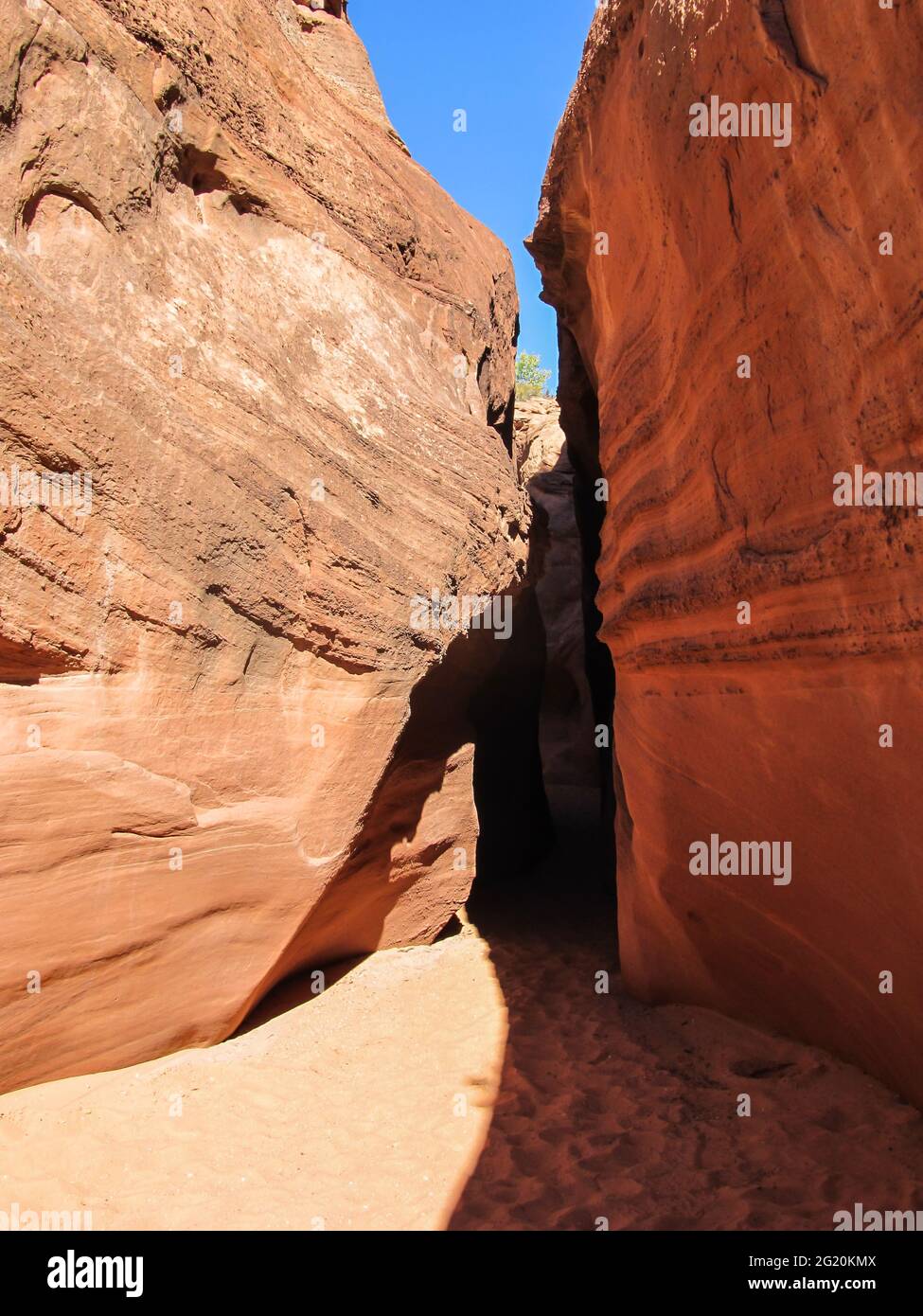 The entrance to Spooky Gulch, an exceptionally narrow slot canyon in the Navajo Sandstone in the Grand Staircase-Escalante National Monument Stock Photo