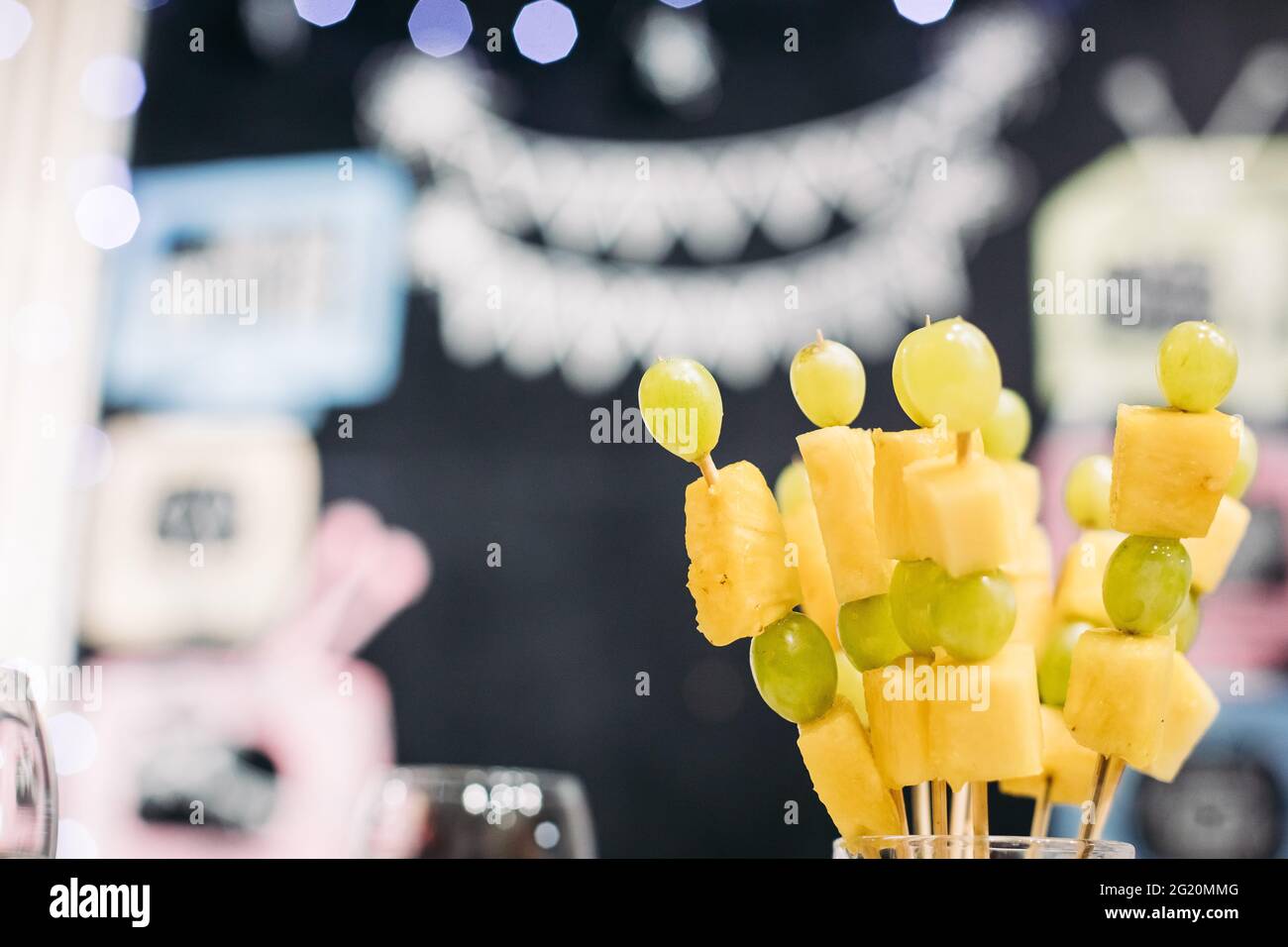 fruit grape and pineapple snack on sticks Stock Photo Alamy