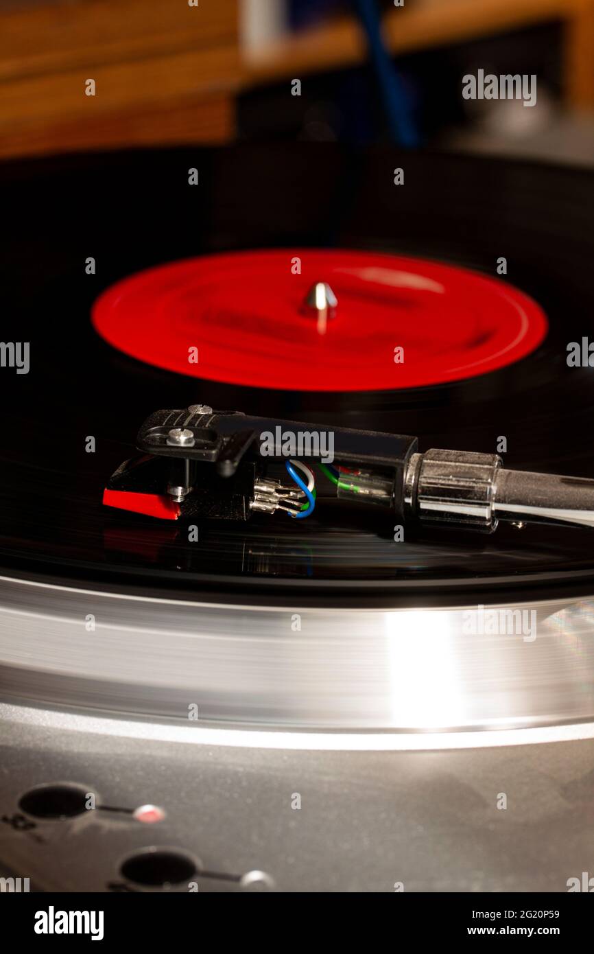 Record usb player turntable with its stylus running on record. Retro