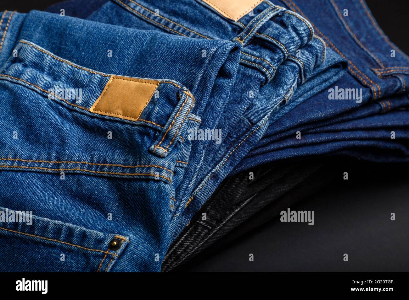 Denim jean pants folded in stack with 