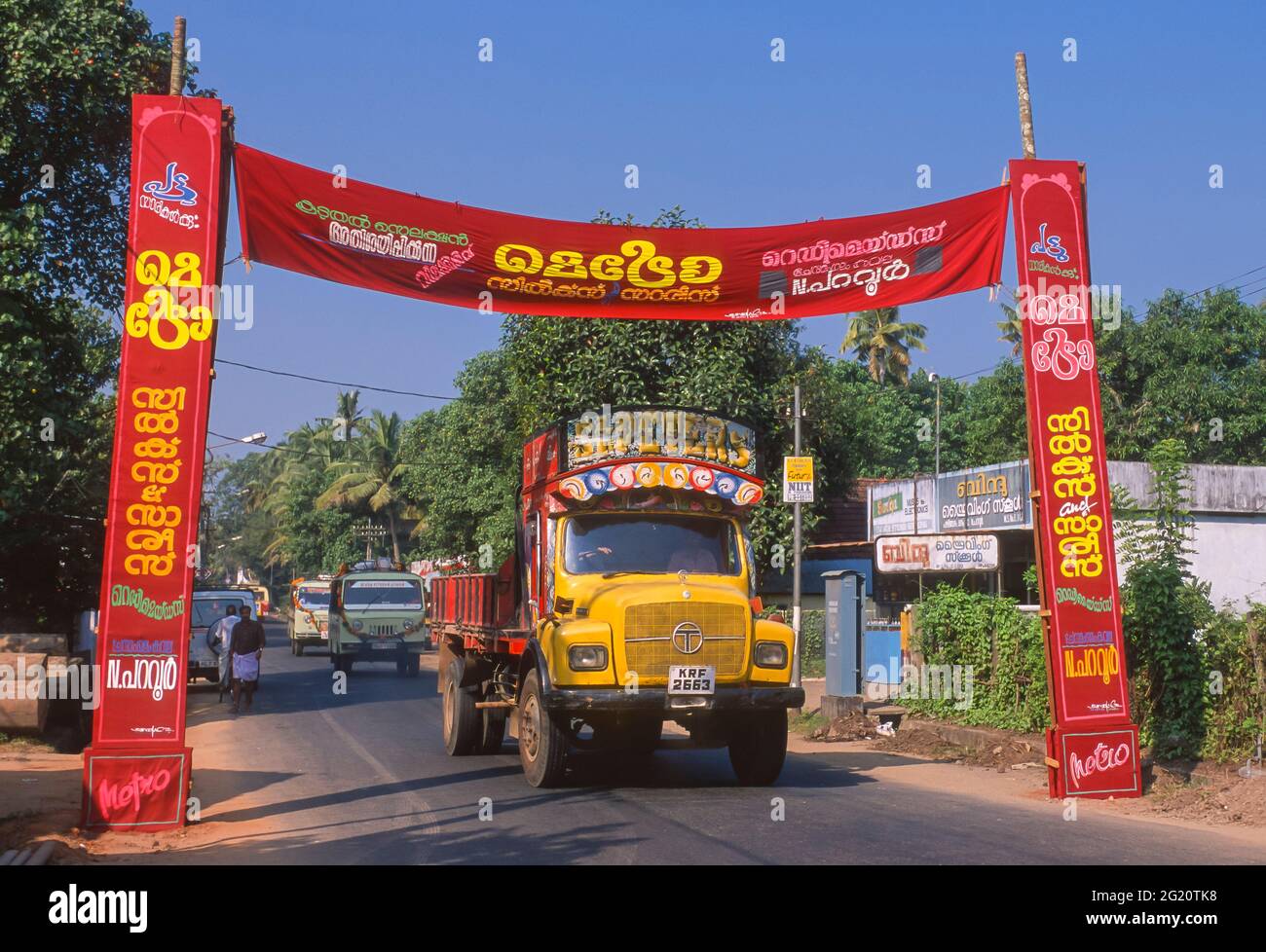 KERALA, INDIA - Colorful truck on street paases under banners. Stock Photo