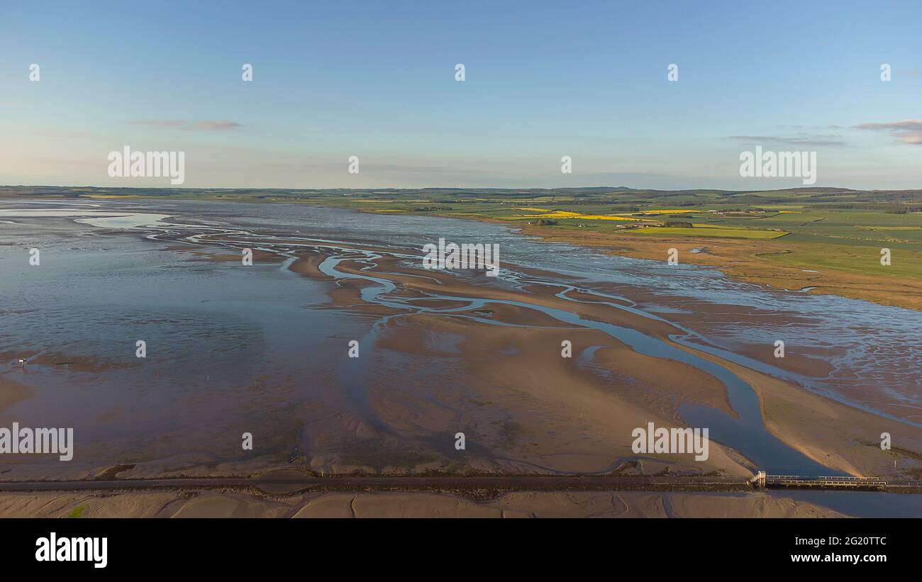 Early morning over the causeway to Holy Island of Lindisfarne, Northumberland, UK Stock Photo