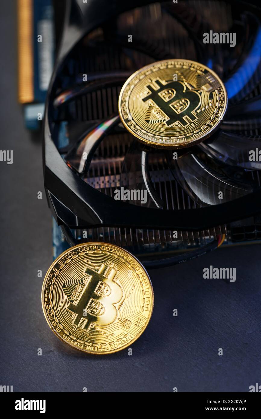 Bitcoin coin on a powerful graphics card for mining and earning  cryptocurrency concept on a dark background. Technologies of the future  currency. Top Stock Photo - Alamy