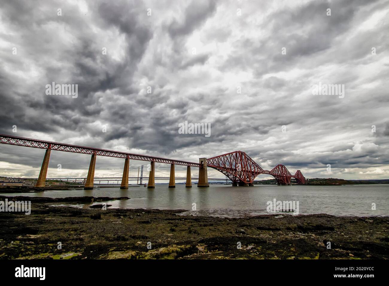 The Forth Bridges crossing the Firth of Forth at Queensferry, Edinburgh, Scotland Stock Photo