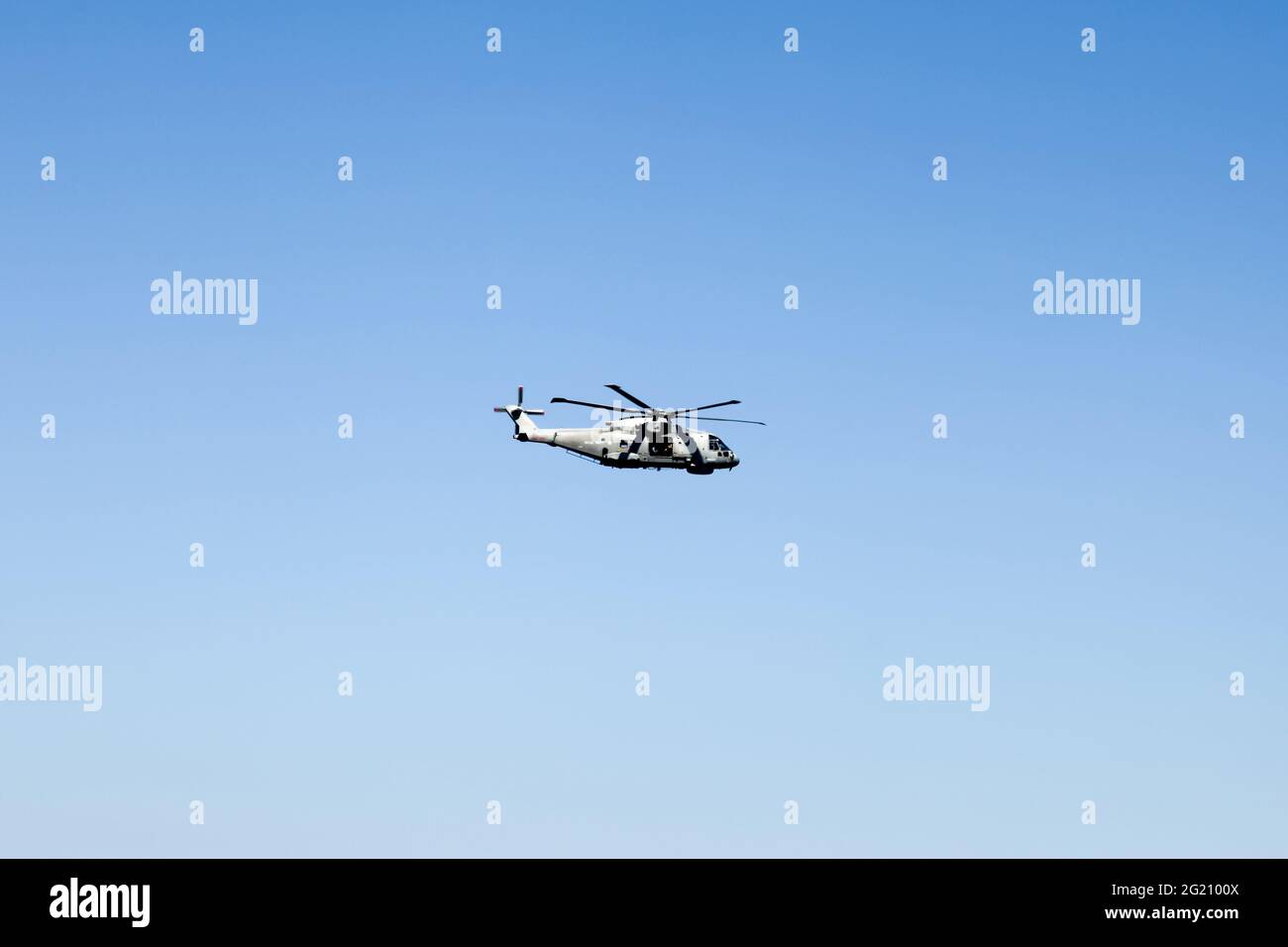 Royal Navy Merlin Helicopter against blue sky flying during G7 summit, St Ives, Cornwall, UK, June 2021 Stock Photo