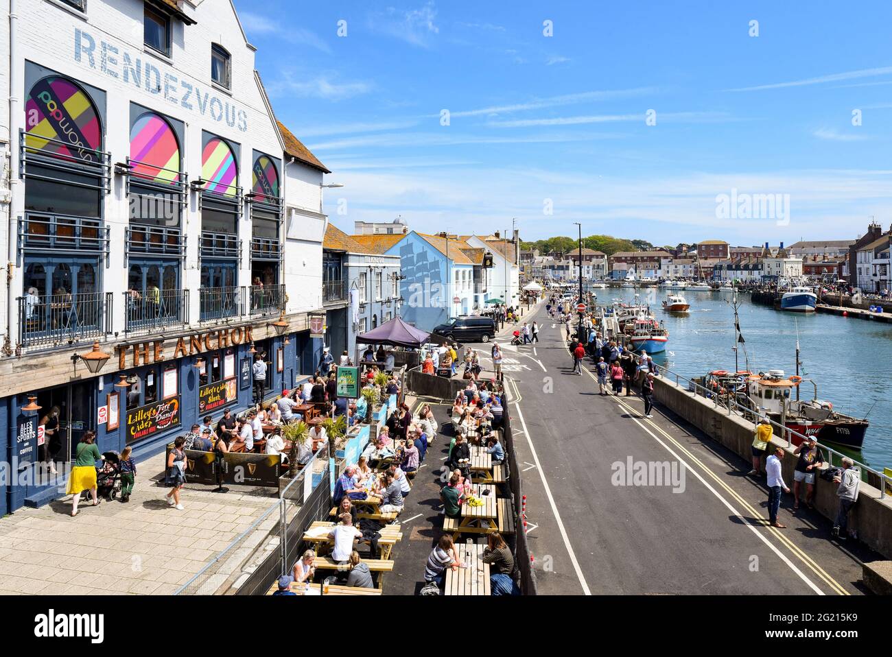 Weymouth on a hot and sunny crowded Bank Holiday Weekend. People dining al fresco and drinking