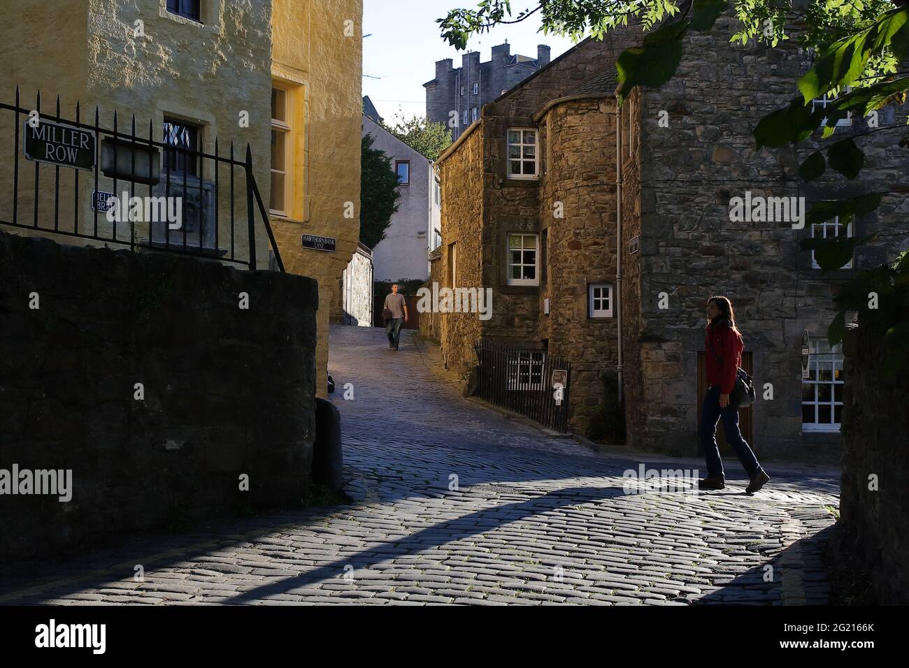 Colors and soft light reflections emphasizing the texture on the walls of the historical buildings along the creek walking route Stock Photo