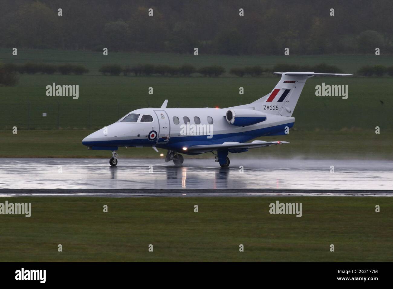 ZM335, an Embraer Phenom T.1 operated by No.45 Squadron of the Royal Air Force, departing from Prestwick International Airport in Ayrshire, Scotland. Stock Photo