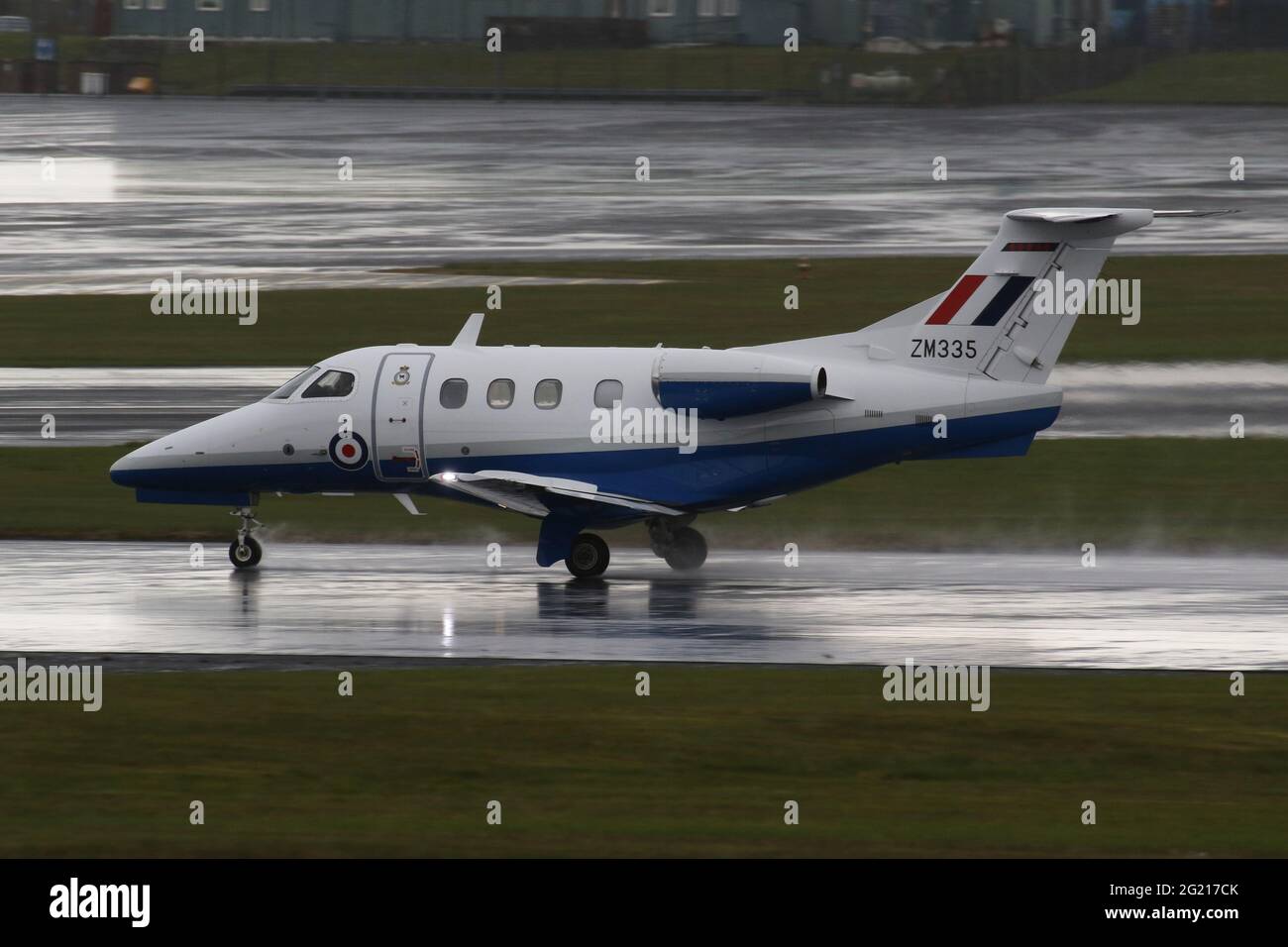 ZM335, an Embraer Phenom T.1 operated by No.45 Squadron of the Royal Air Force, departing from Prestwick International Airport in Ayrshire, Scotland. Stock Photo