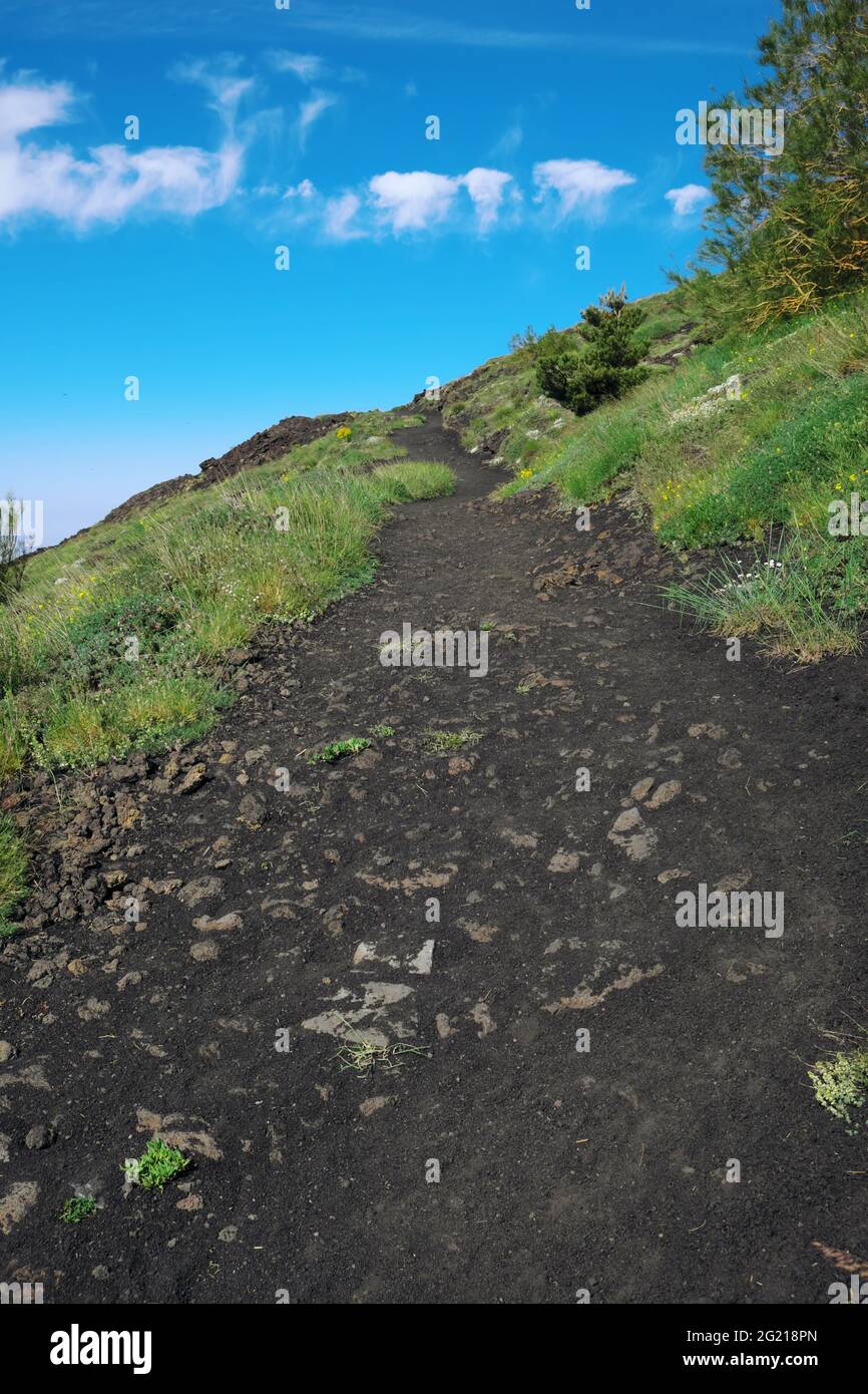 high mountain trail, ground of volcanic rocks and ash in Etna Park