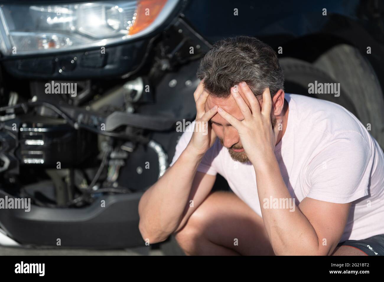upset man driver at broken car after automobile collision car accident, car crash Stock Photo